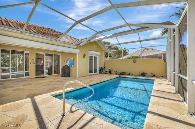 view of pool featuring a patio and a lanai