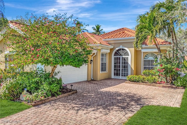 mediterranean / spanish-style house featuring a garage