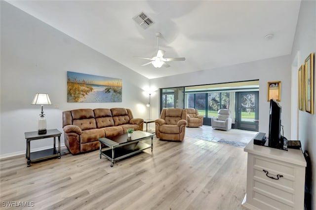 living room with vaulted ceiling, ceiling fan, and light hardwood / wood-style flooring