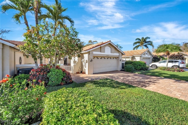 view of front of house with a garage and a front yard