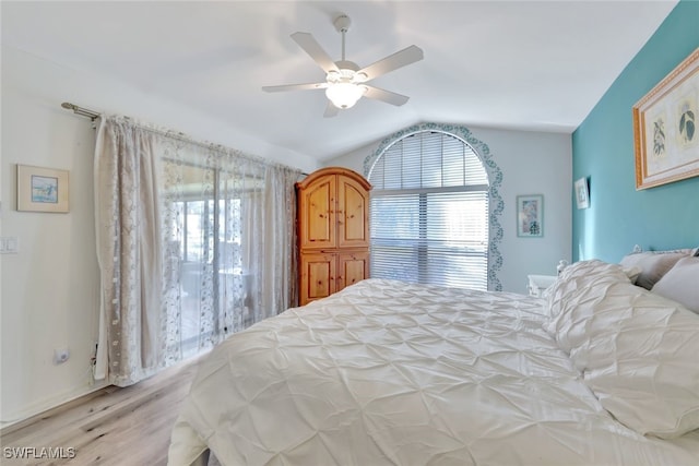 bedroom with lofted ceiling, ceiling fan, and light wood-type flooring