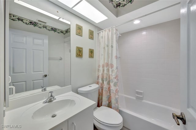 full bathroom with vanity, shower / bath combination with curtain, and toilet