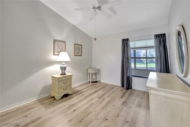 interior space with vaulted ceiling, ceiling fan, and light hardwood / wood-style flooring