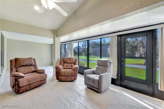 sunroom / solarium featuring ceiling fan and lofted ceiling