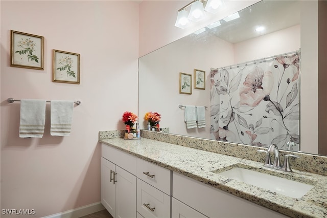 bathroom with vanity and a shower with shower curtain