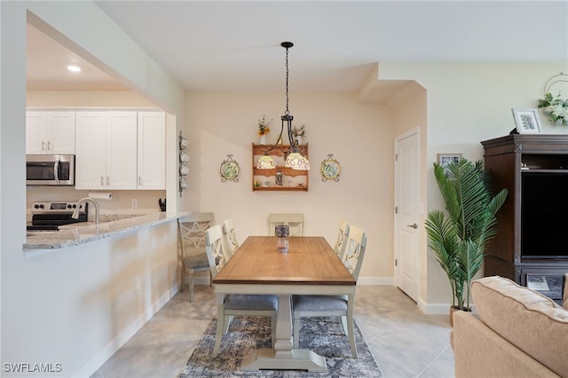 dining room featuring sink