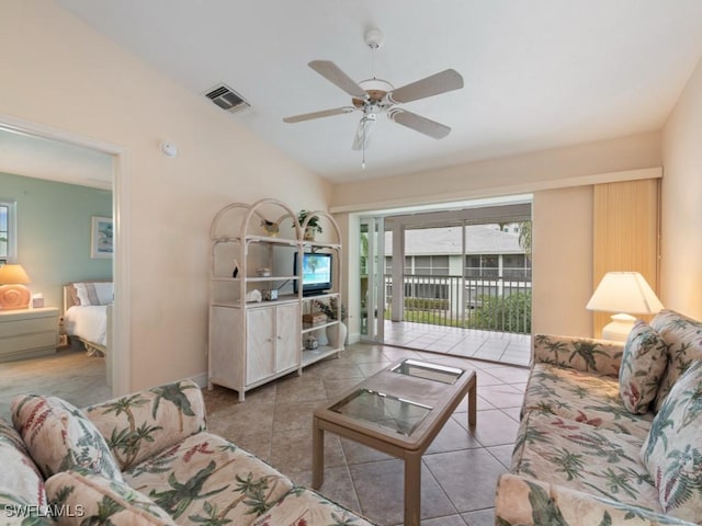 living room featuring light tile patterned flooring, ceiling fan, and a healthy amount of sunlight