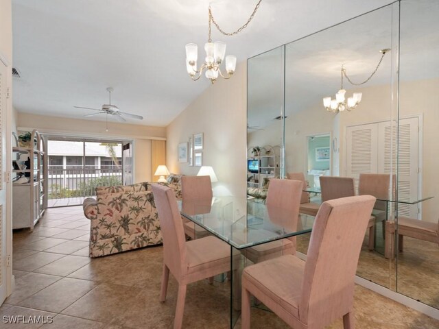 dining room featuring high vaulted ceiling, ceiling fan with notable chandelier, and light tile patterned floors