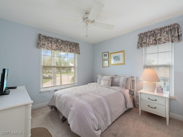 bedroom with light colored carpet and ceiling fan