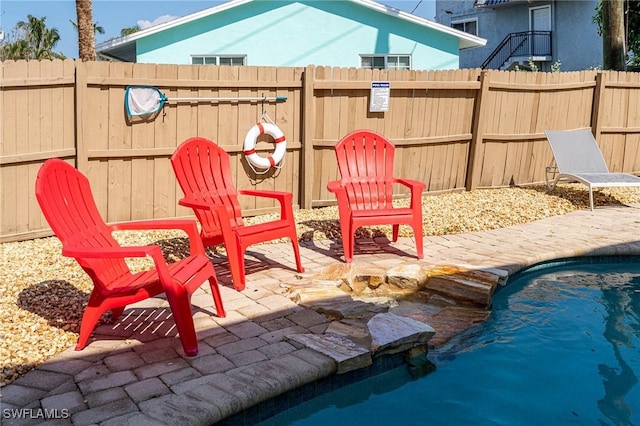 view of patio featuring a fenced in pool