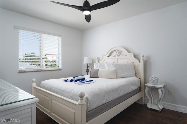 bedroom featuring ceiling fan and dark hardwood / wood-style flooring