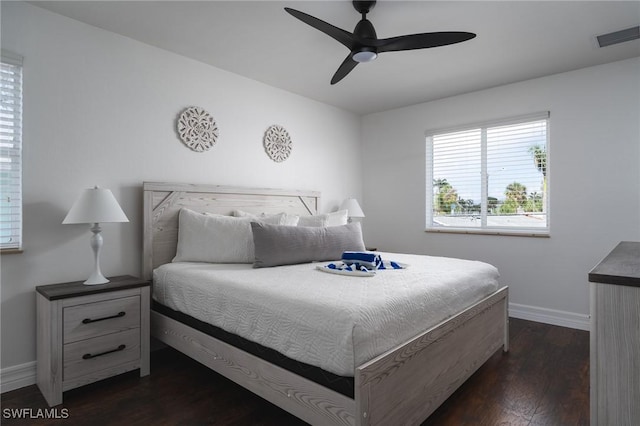 bedroom featuring dark hardwood / wood-style floors and ceiling fan