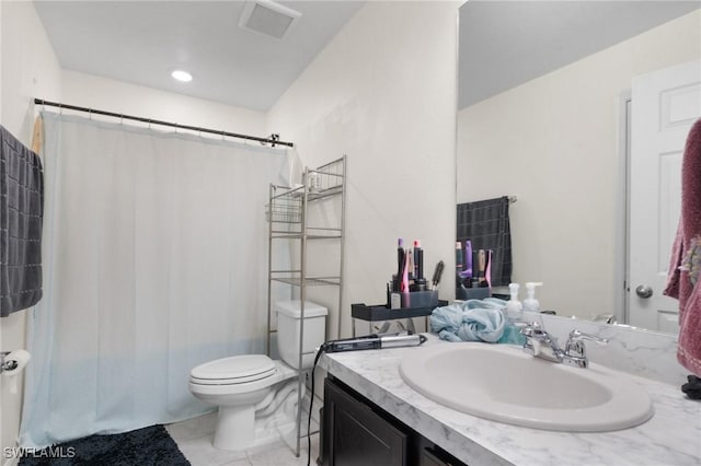 bathroom with a shower with curtain, vanity, tile patterned flooring, and toilet