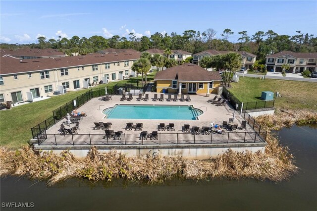 exterior space featuring a water view, a yard, and a patio