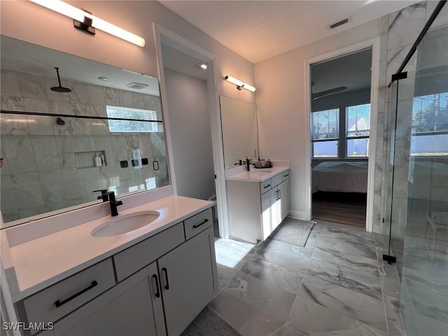 bathroom featuring vanity and an enclosed shower