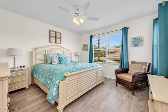 bedroom featuring ceiling fan and light hardwood / wood-style floors