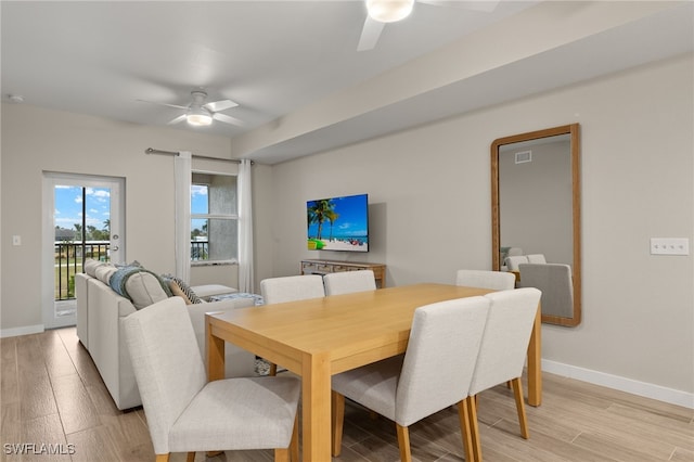 dining room featuring ceiling fan and light hardwood / wood-style flooring