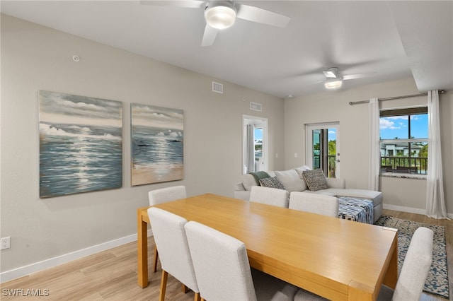 dining area featuring light hardwood / wood-style flooring and ceiling fan