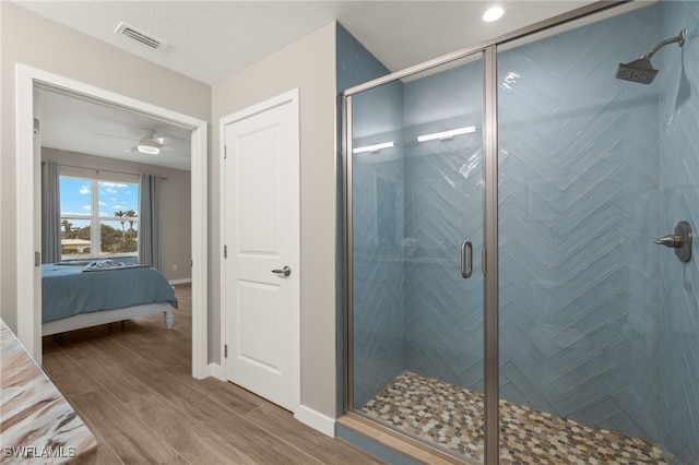 bathroom featuring a shower with door