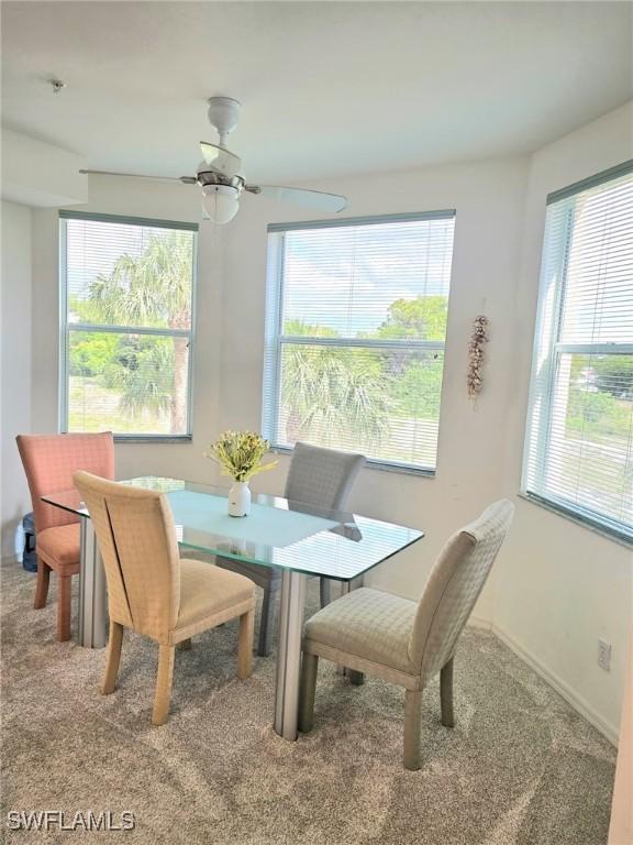 4015 Palm Tree Blvd Unit 304, Cape Coral, FL 33904 - dining room with carpet floors, ceiling fan, and baseboards