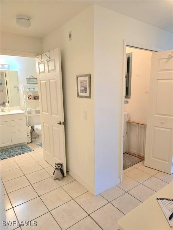 4015 Palm Tree Blvd Unit 304, Cape Coral, FL 33904 - bathroom with tile patterned floors, toilet, vanity, and baseboards