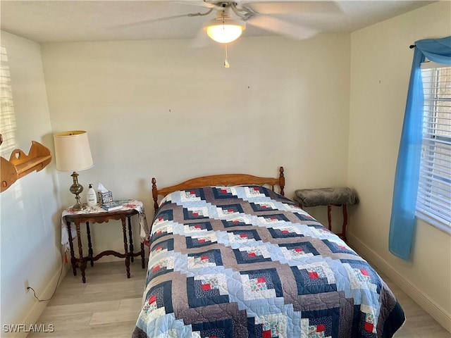 bedroom featuring ceiling fan and light wood-type flooring