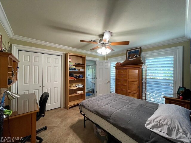 bedroom featuring light tile patterned floors, crown molding, a closet, and ceiling fan