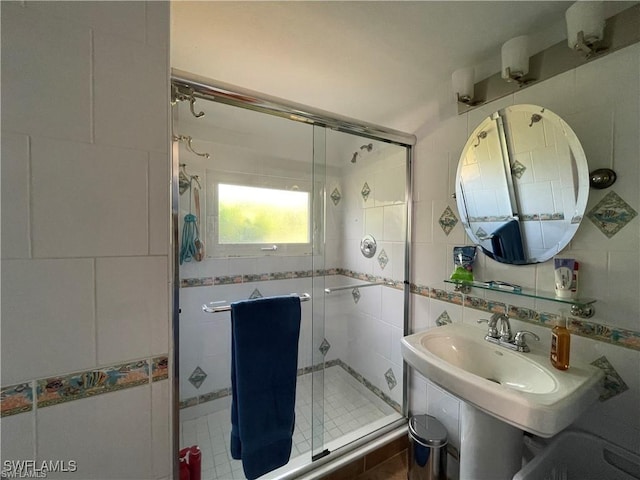 bathroom featuring tile walls, backsplash, and walk in shower