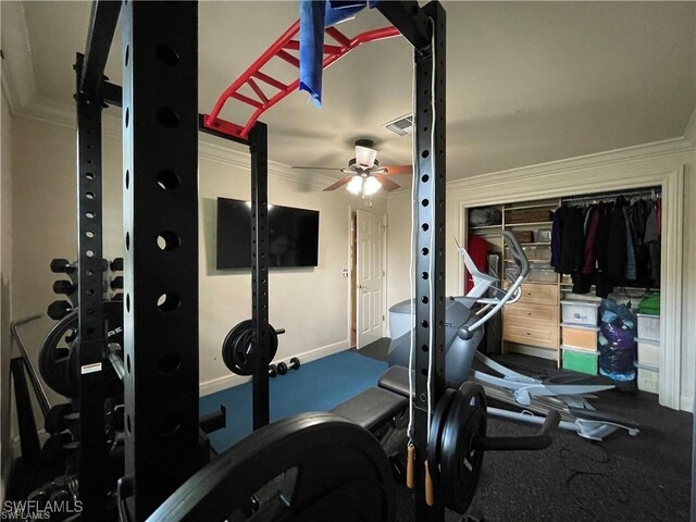 exercise room featuring crown molding and ceiling fan