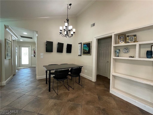 dining area featuring an inviting chandelier, crown molding, and a towering ceiling