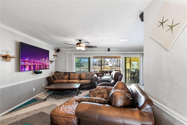 carpeted living room featuring crown molding and ceiling fan