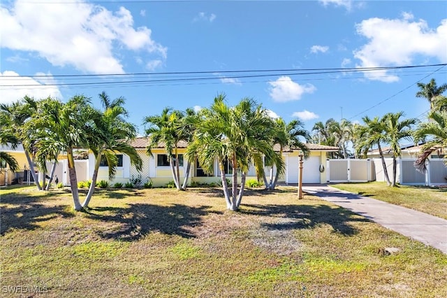 mediterranean / spanish house with a front yard