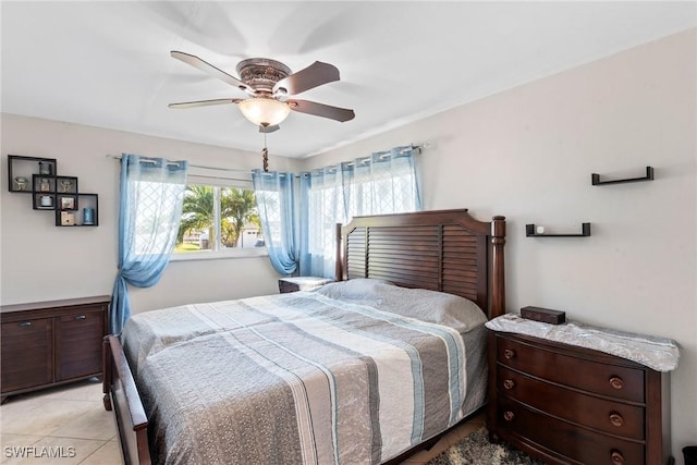 bedroom with light tile patterned floors and ceiling fan