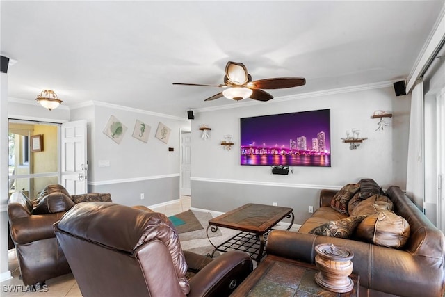 tiled living room with ornamental molding and ceiling fan