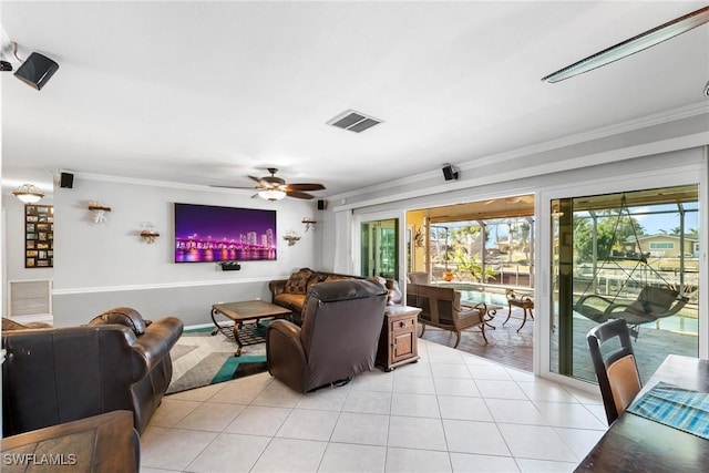 tiled living room with crown molding and ceiling fan