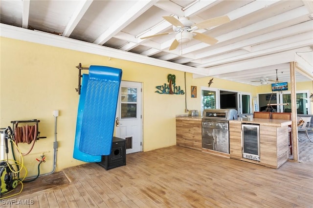 kitchen with wine cooler, light hardwood / wood-style flooring, beamed ceiling, and ceiling fan