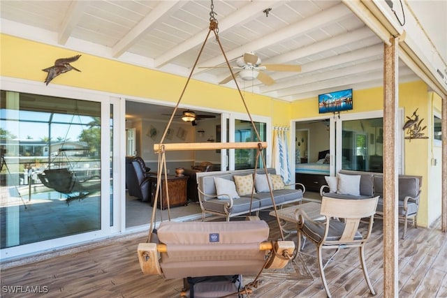 wooden deck featuring an outdoor hangout area and ceiling fan