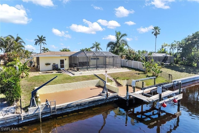 view of dock with a yard, a lanai, a pool, and a water view