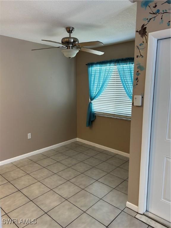 empty room featuring ceiling fan