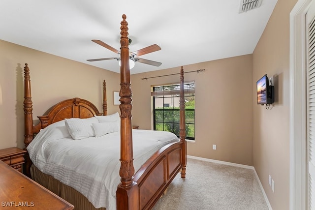 bedroom with light carpet and ceiling fan