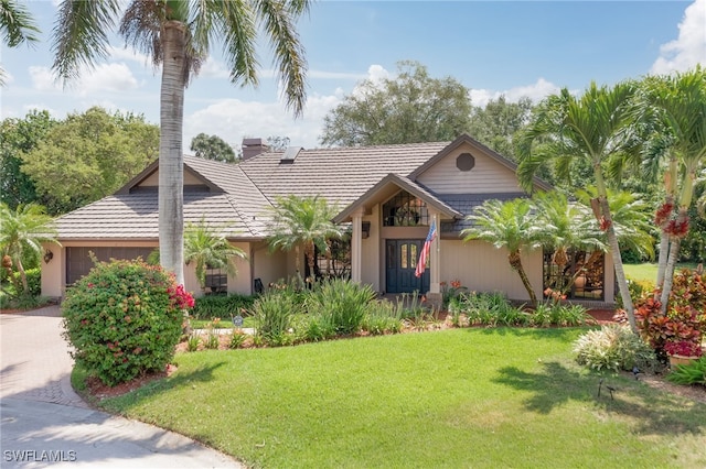 view of front facade with a garage and a front yard