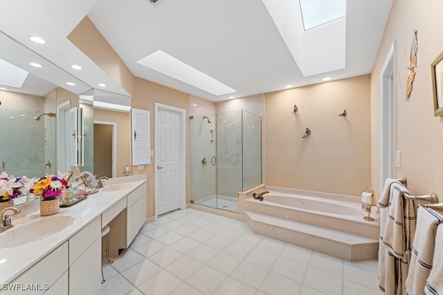 bathroom featuring vanity, a skylight, tile patterned floors, and shower with separate bathtub