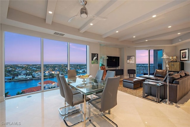 dining area featuring light tile patterned floors, beamed ceiling, and ceiling fan