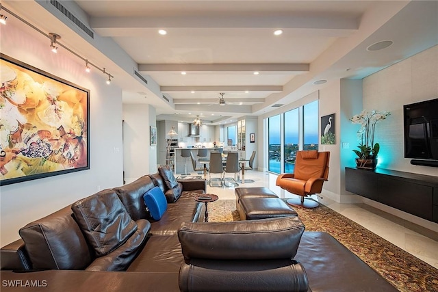 interior space with beamed ceiling and ceiling fan