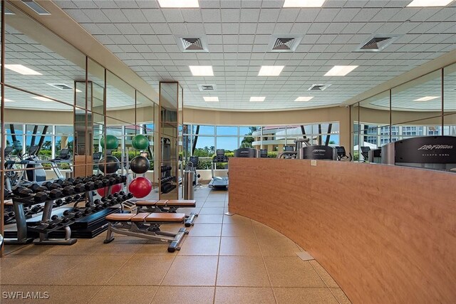 exercise room featuring a drop ceiling