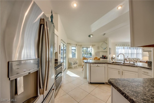 kitchen with sink, white dishwasher, white cabinets, stainless steel fridge with ice dispenser, and decorative light fixtures