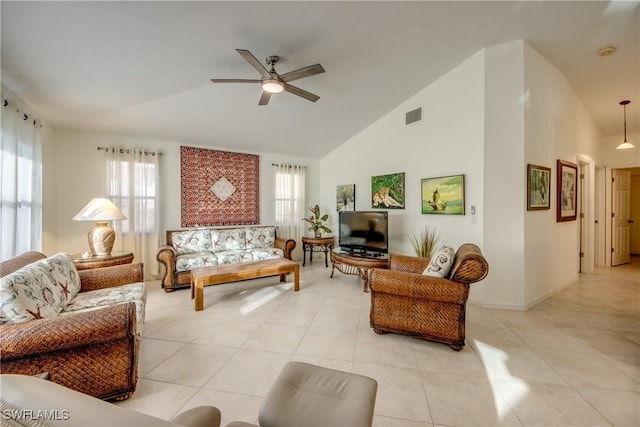 living room featuring high vaulted ceiling, a healthy amount of sunlight, light tile patterned floors, and ceiling fan