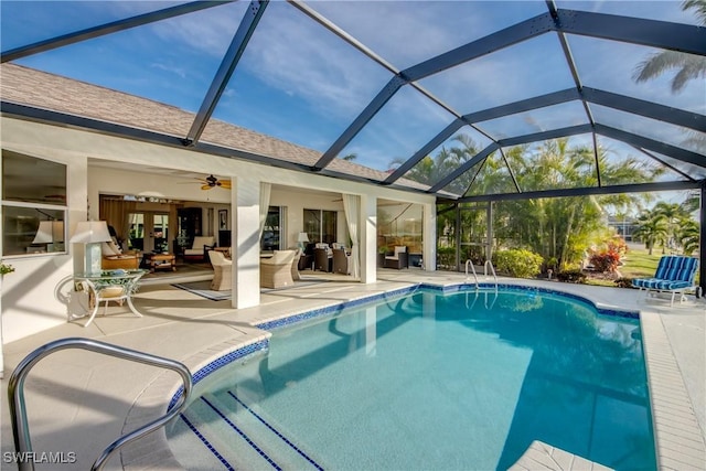 view of pool with a lanai, outdoor lounge area, a patio, and ceiling fan