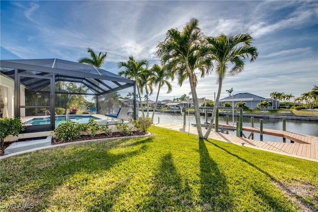 exterior space with a water view, a boat dock, and glass enclosure