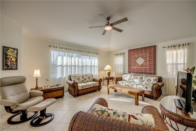 living room with light tile patterned flooring, a healthy amount of sunlight, and ceiling fan